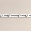 White Control Panel Featuring Multiple Round Knobs On Light Background