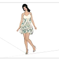 Woman In White Sleeveless Green Floral Print Short Dress With High Heels