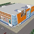 Modern Commercial Complex With Orange Blue Glass Facade Advertisement Billboards Parking Area And Greenery