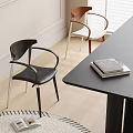 Modern Dining Chairs With Black Leather Armrests And Wooden Frame White Cushion Near Black Table
