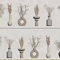Display of Various Materials Different Shapes Vases with Dried Flowers on White Shelves