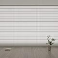 White Venetian Blinds Covering Large Window In Modern Room With Wooden Floor And Green Plant