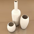 Elegant White Vases with Intricate Carved Patterns and Various Shapes on Beige Background