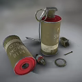 Military Smoke Grenade With Red Base And Scattered Metal Parts On Surface
