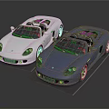 Two Silver And Blue Convertible Sports Cars With Sleek Design And Glossy Finish