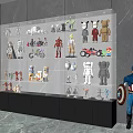 Glass Display Cabinet Showcasing Action Figures Collectibles And Models With Illuminated Shelves