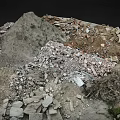 Rocky Mountainous Terrain With Debris Soil And Small Vegetation