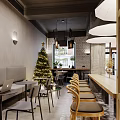Cozy Restaurant Interior With Christmas Tree Long Wooden Table Sofa Seats And Chairs