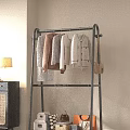 Modern Interior Floor Standing Clothes Rack With Hanging Sweaters And Small Hangers