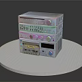 Stacked Electronic Audio Equipment With Knobs Buttons On White Round Platform