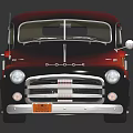 Classic Red And Black Pickup Truck With Flame Graphics On Dark Background