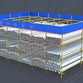 Building Components Storage Area With Blue Canopy Yellow Scaffolding Stacked Metal Pipes And Profiles