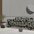 Two Seater Sofa With Black And White Geometric Pattern And Green Plant Round Mirror