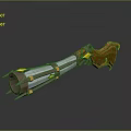 Silver Metallic Blaster Weapon With Long Cylindrical Body Yellow Accents And Brown Tassel Details