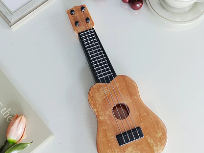 Wooden Ukulele and Art Supplies Displayed on White Table with Decorative Items 3d model