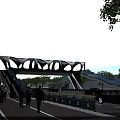 Modern Pedestrian Bridge with Multiple Arched Structure in Urban Area Featuring Trees Pedestrians and Vehicles