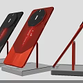 Contemporary Smartphones in Black and Red Displayed on Red Stands with White Bases