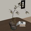 Decorative Ornament Set Including Vase Leafy Branches Open Book Stacked Books Small Bowl On Table