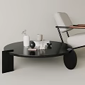 Modern Black Round Coffee Table With Decorative Vase Books In Living Room