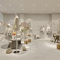 Modern Clothing Store Interior With Clothing Racks Mannequins And Decorative Plants
