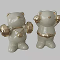 White Ceramic Bear Sculptures With Gold Accents Holding Dumbbells And Balls