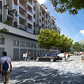 Modern Residential Entrance Gate with Surrounding Apartment Buildings Pedestrians and Green Trees