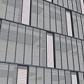 Modern Office Building Exterior With Glass Facade And Vertical White Stripes