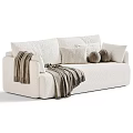 Cream Plush Two Seater Sofa With Decorative Pillows And Cozy Blanket