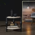 Modern Side Table With Marble Top Black Legs And Decorative Items In Living Room