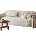 Cozy Light Beige Multi Seater Sofa With Soft Pillows Blanket And Wooden Side Table