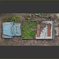 Old Blue Truck With Worn Body Loaded Green Plants On Gravel Ground