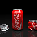Red Coca-Cola Beverage with Intact Can and Crushed Aluminum Cans