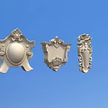 Three Different Metallic Carved Decorations With Ornate Patterns On Blue Background