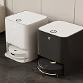 Two White And Black Robotic Vacuum Cleaners On Indoor Floor For Smart Home