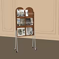 Wooden Storage Shelf with Silver Metal Legs and Wheels Holding Books on Decorative Wall Background