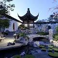Chinese Courtyard Garden With Pagoda Stone Bridge Water Lily Pond And Cherry Blossom Tree