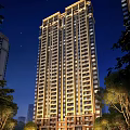 Modern High Rise Residential Building Illuminated At Night With Exterior Lights And Trees