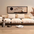 Beige Multi Person Sofa With Plush Cushions Oriental Wall Art Dried Pampas Grass And Books