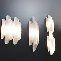 Modern White Curved Wall Lamps Mounted on Dark Wall with Illuminated Design