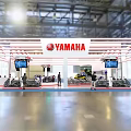 YAMAHA Exhibition Booth With White Red Striped Design And Displayed Motorcycles Screens