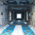 Futuristic Spacecraft Interior Featuring Circular Blue Devices Control Panels Window And Flooring Pattern