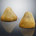Two Conical Traditional Straw Stacks With Support Sticks On Reflective Surface