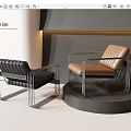 Modern Accent Chairs In Black And Brown With Metal Frames And Leather Seats On