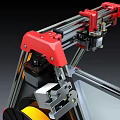 Red 3D Printer With Metal Frame Yellow Filament Spool And Display Screen As Office Appliance