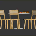 Round Red Dining Table With Three Wooden Chairs And Fast Food On Top
