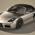 Silver Convertible Sports Car With Black Soft Top And Sporty Alloy Wheels Design