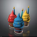 Colorful Cupcakes with Pink Blue Yellow Frosting Lit Candles and Sprinkles on Shiny Black Background