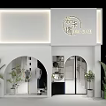 Modern White Clothing Store With Arched Doorway Glass Doors And Green Plants