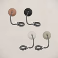 Modern Various Colored Wall Sconces With Round Bases Mounted On Gray Wall 3d model
