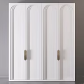 Stylish White Cabinet Doors Featuring Vertical Stripes and Polished Brass Handles